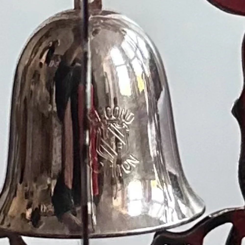 Vintage Reed & Barton silver spinning snowflake  & bell Christmas ornament